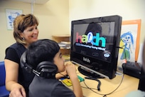 Elsa Gonzalez, Child Development Center program assistant, helps Joshua Cortez with the Hatch computer program at the Child Development Center on Joint Base San Antonio-Randolph Feb. 21. The Hatch program teaches alphabet knowledge, phonological awareness, memory and educational games.  (U.S. Air Force photo/Rich McFadden) (released)