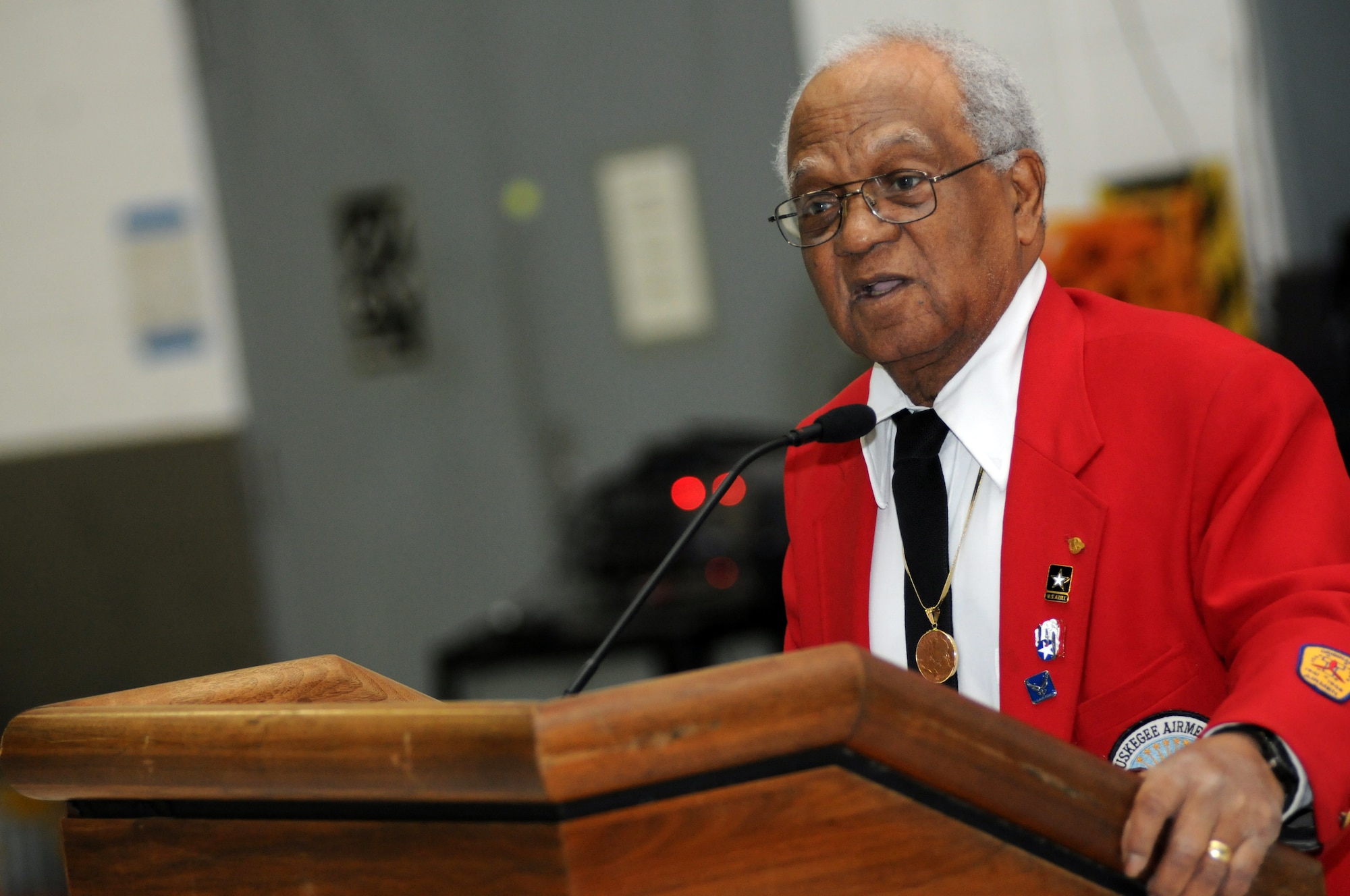 William T. Fauntroy Jr., a Tuskegee Airman and resident of the District of Columbia, speaks to Soldiers and family members from the Operational Support Airlift Agency during a ceremony to celebrate Black History Month at Davison Army Airfield, Fort Belvoir, Va., Feb. 21, 2012. (Army National Guard photo by Sgt. Darron Salzer)