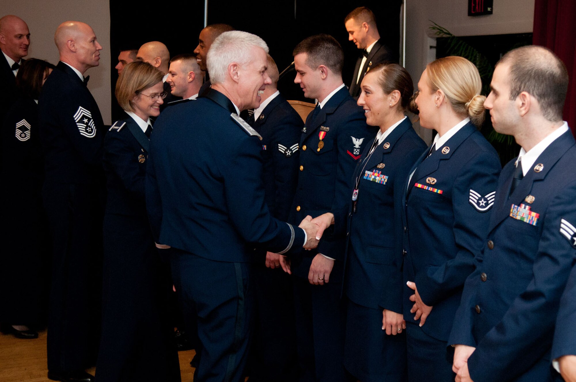 HANSCOM AIR FORCE BASE, Mass. – Lt. Gen. CR Davis (middle), Electronic Systems Center commander, and senior leaders from across the base, congratulate Airman Leadership School Class 12B graduates during the graduation ceremony at the Minuteman Commons Feb. 17.  By completing ALS, 12 Airmen and Coast Guardsmen took the next step of professional military education. (U.S. Air Force photo by Rick Berry)