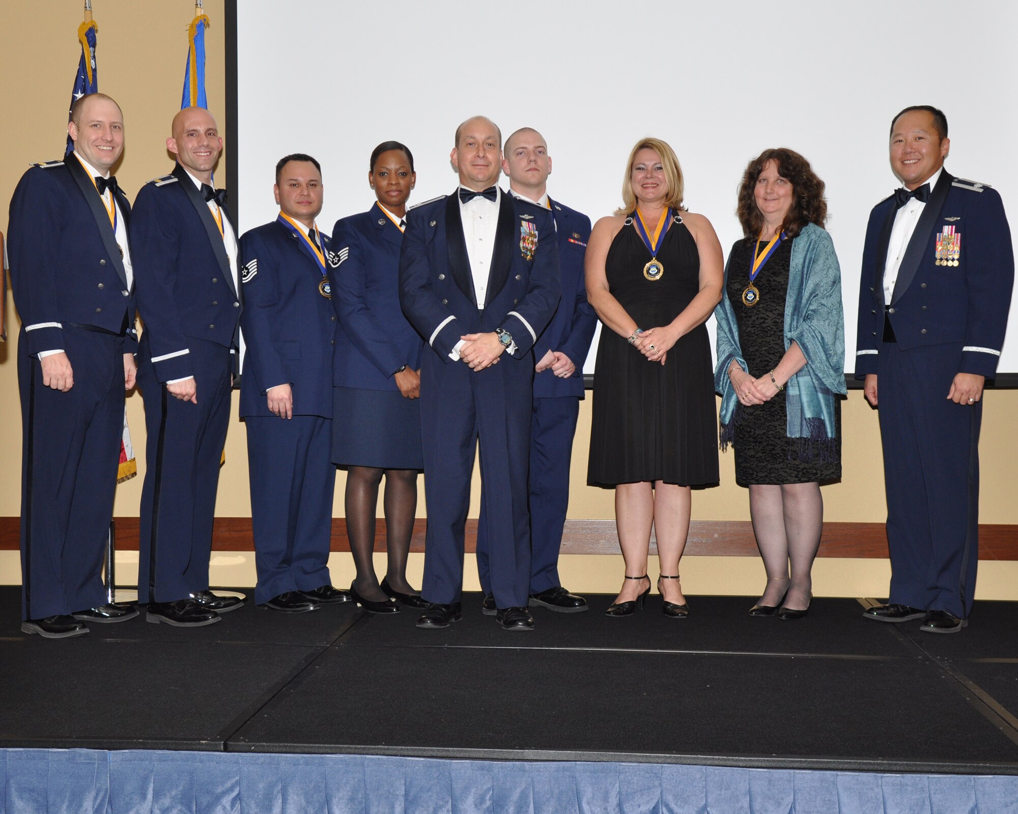 Col. Mustafa Koprucu, commander of the 505th Command and Control Wing, center, poses with award winners during the 505th CCW's annual awards ceremony at Hurlburt Field, Fla., Feb. 10, 2012.  The theme of this year's banquet was "A Commitment to Airmen." (Courtesy photo)
