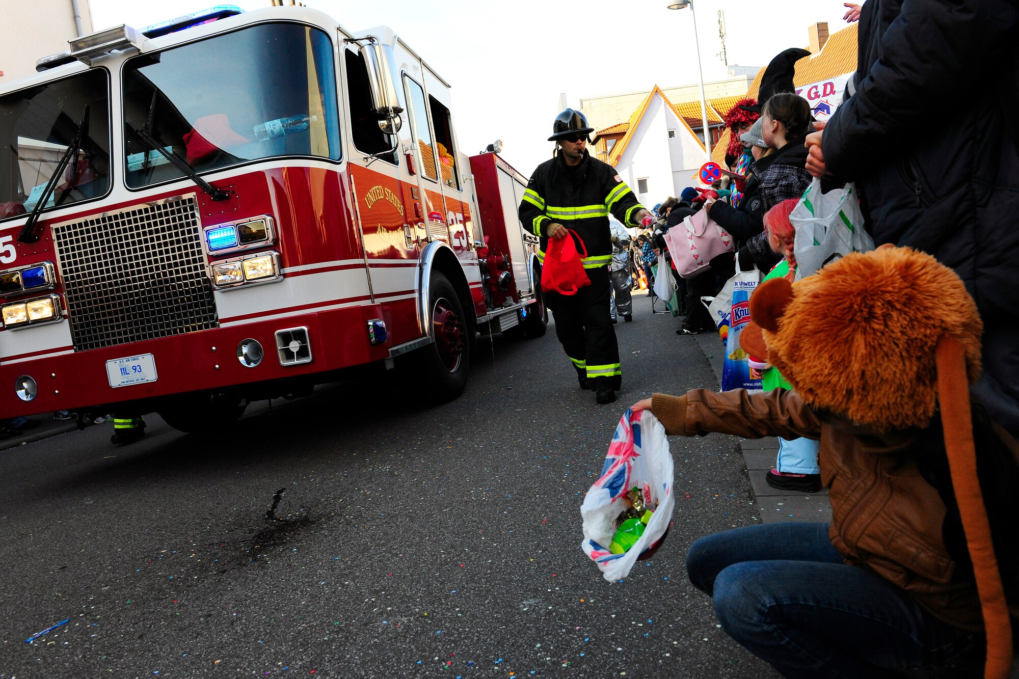 U.S Air Force fire department participate in the annual celebration of Fasching parade, Ramstein Village, Germany, Feb. 21, 2012. This annual event is a pre-Lenten carnival which is celebrated with the donning of wild and fancy costumes to chase away the evil spirits of winter in preparation for spring. (U.S. Air Force photo by Staff Sgt. Chris Willis) 