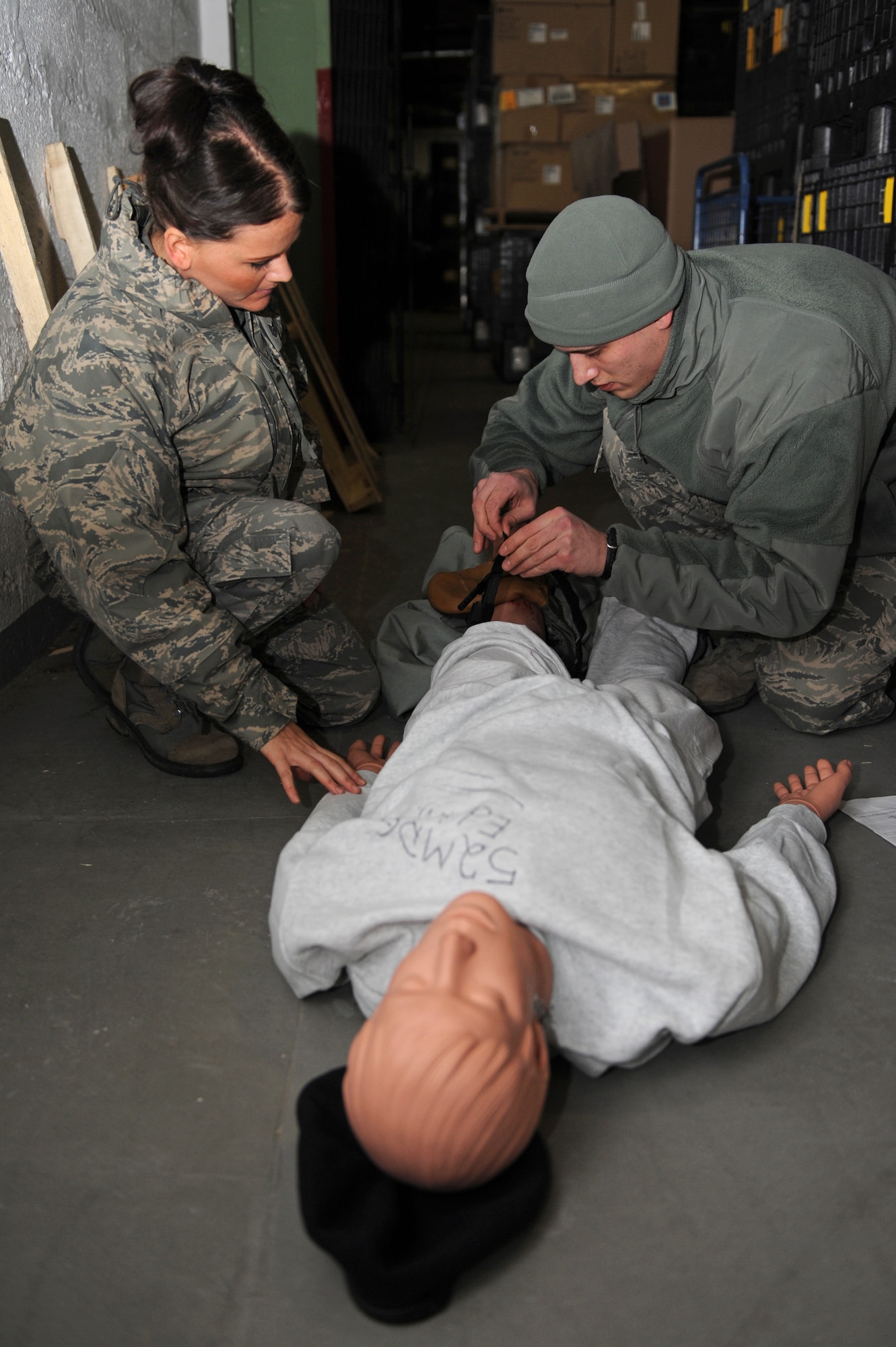 SPANGDAHLEM AIR BASE, Germany – Tech. Sgt. Ronna Cabello, left, and Airman 1st Class Ross Konicke, 52nd Aerospace Medicine Squadron field response team members, treat a mock victim for injuries during an active-shooter training exercise at Bldg. 103 here Feb. 17. The 52nd Fighter Wing conducted the exercise to test the wing’s response to an active-shooter situation. Training like this readies the base to respond to real emergency events protecting base members and U.S. government assets. (U.S. Air Force photo by Airman 1st Class Matthew B. Fredericks/Released)