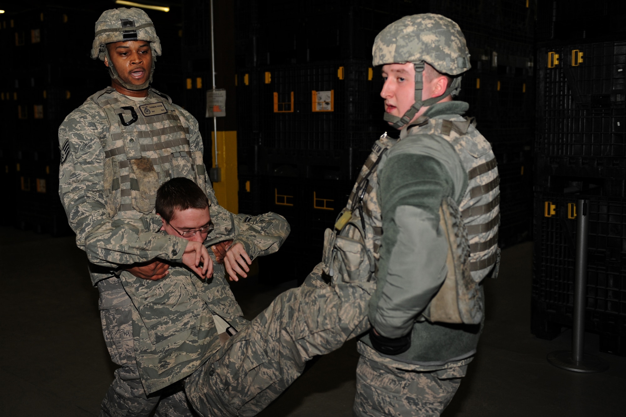 SPANGDAHLEM AIR BASE, Germany –Staff Sgt. Kasmere Redvine, left, and Senior Airman Nicholas Stockton, 52nd Security Forces Squadron first responders, carry a mock victim out of Bldg. 103 here during an active-shooter training exercise Feb. 17. The 52nd Fighter Wing conducted the exercise to test the wing’s response to an active-shooter situation. Training like this readies the base to respond to real emergency events protecting base members and U.S. government assets. (U.S. Air Force photo by Airman 1st Class Matthew B. Fredericks/Released)