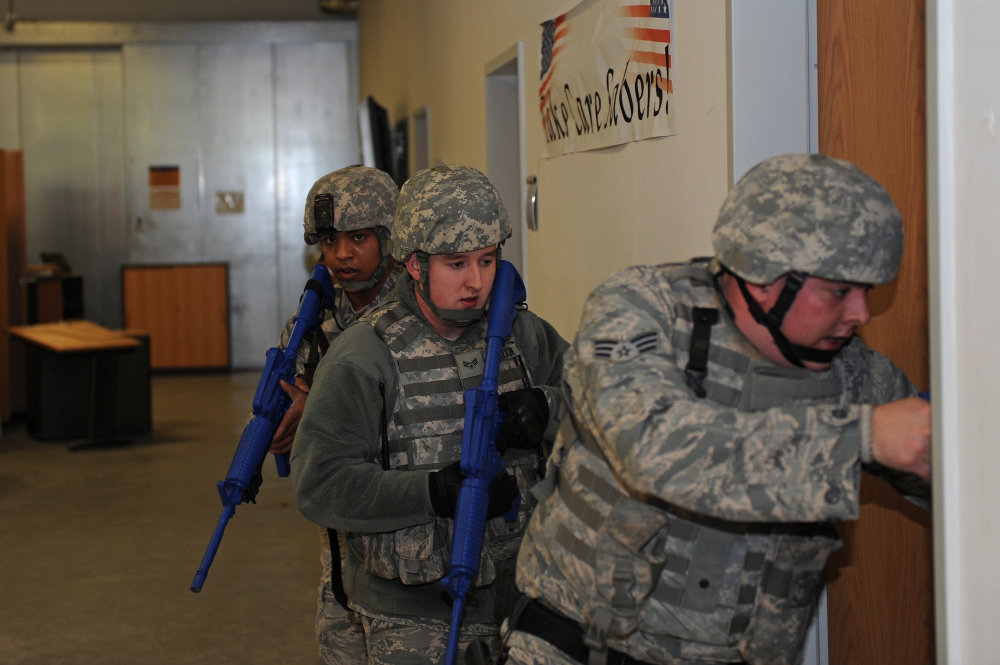 SPANGDAHLEM AIR BASE, Germany – Airmen from the 52nd Security Forces Squadron rush into a room to search for a shooter during an active-shooter training exercise at Bldg. 103 here Feb. 17. The 52nd Fighter Wing conducted the exercise to test the wing’s response to an active-shooter situation. Training like this readies the base to respond to real emergency events protecting base members and U.S. government assets. (U.S. Air Force photo by Airman 1st Class Matthew B. Fredericks/Released)