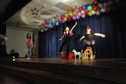 (From left to right) Rylee, Sharlee, Baylee and Everett Krkosa (not shown) perform "Never Grow Up" at the You Got Talent Family Teen Talent Contest at the Airman and Family Readiness Center on Joint Base San Antonio-Randolph Feb. 17. The group took first place in the Teen Group category.(U.S. Air Force photo/Rich McFadden) (released)