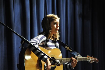 Rebekah Landry plays guitar and sings "Rhythm of Love" by the Plain White T's at the You Got Talent Family Teen Talent Contest at the Airman and Family Readiness Center on Joint Base San Antonio-Randolph Feb. 17. Rebekah took first place in the Teen Specialty category. (U.S. Air Force photo/Rich McFadden) (released)