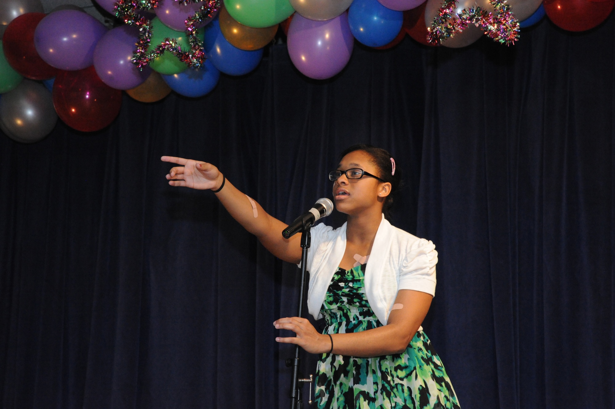 Jazmine White sings “Fix a Heart” by Demi Lovato at the You Got Talent Family Teen Talent Contest Feb. 17 at the Airman and Family Readiness Center on Joint Base San Antonio-Randolph. Jazmine took first place in the Teen Vocal category. For the complete story on the event. (U.S. Air Force photo/Rich McFadden) (released)