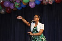 Jazmine White sings “Fix a Heart” by Demi Lovato at the You Got Talent Family Teen Talent Contest Feb. 17 at the Airman and Family Readiness Center on Joint Base San Antonio-Randolph. Jazmine took first place in the Teen Vocal category. For the complete story on the event. (U.S. Air Force photo/Rich McFadden) (released)
