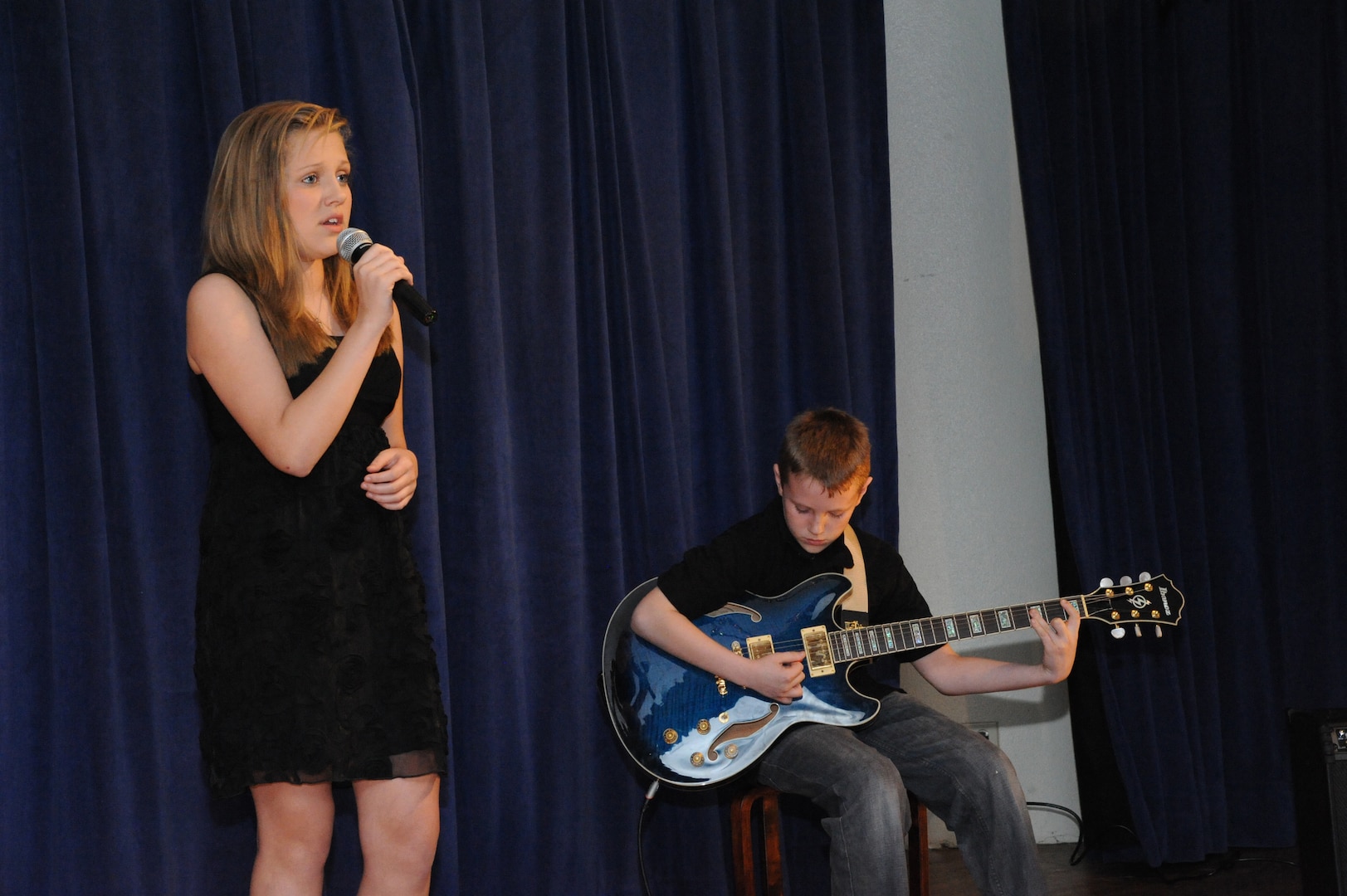 (From Left) Katryna and Logan Marttala perform "Set Fire to the Rain" by Adele at the You Got Talent Family Teen Talent Contest at the Airman and Family Readiness Center on Joint Base San Antonio-Randolph Feb. 17. They took first place in the Pre-Teen Group Act category.(U.S. Air Force photo/Rich McFadden) (released)