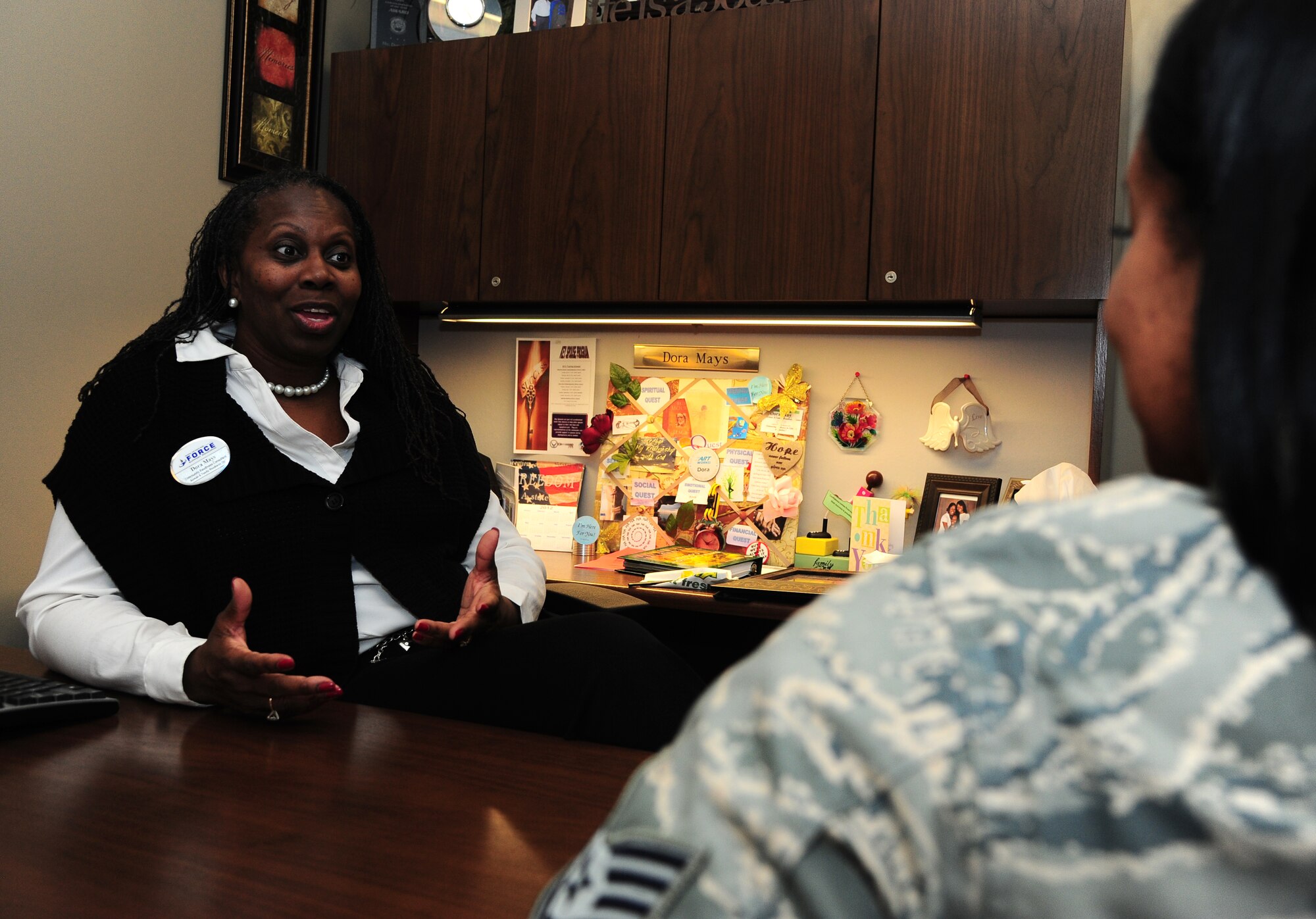 Dora Mays, a community readiness consultant from the Airman and Family Readiness Center, gives advice to an Airman, Feb. 16, 2012 at MacDill Air Force Base, Fla. The A&FRC offers many support services to MacDill’s military members and their families. (U.S.  Air Force photo by Airman Basic David Tracy)
