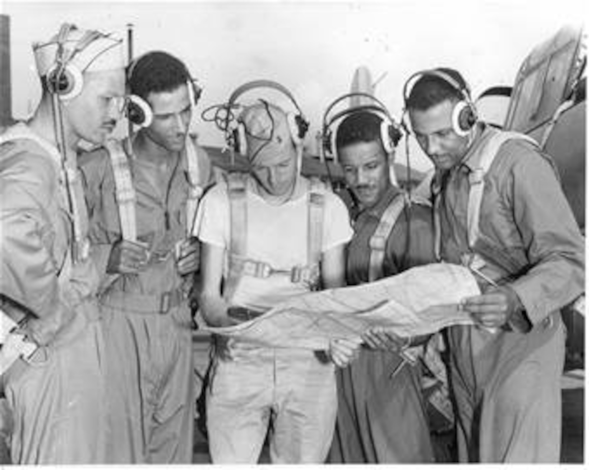 Archie Williams goes over weather conditions before a flight