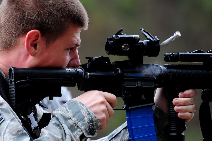 Senior Airman Timothy Rantala fires his M4A1 rifle during a "Shoot, Move, Communicate" training course at Joint Base Charleston - Air Base Feb. 16. The training teaches Airmen to react to a hostile shooter by using cover and effective communication to maneuver and engage the target. Rantala is a 628th Security Forces Squadron patrolman.  (U.S. Air Force photo/ Staff Sgt. Nicole Mickle) 