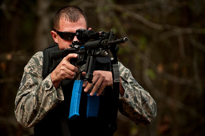 Staff Sgt. Timothy Garrett practices reloading drills with his M4A1 during a “Shoot, Move, Communicate” training course at the Combat Arms Training and Maintenance range at Joint Base Charleston - Air Base Feb. 16. The training teaches Airmen to react to a hostile shooter by using cover and effective communication to maneuver and engage the target. Garrett is a 628th Security Forces Squadron K-9 handler at JB Charleston - Air Base. (U.S. Air Force photo by Airman 1st Class George Goslin)
