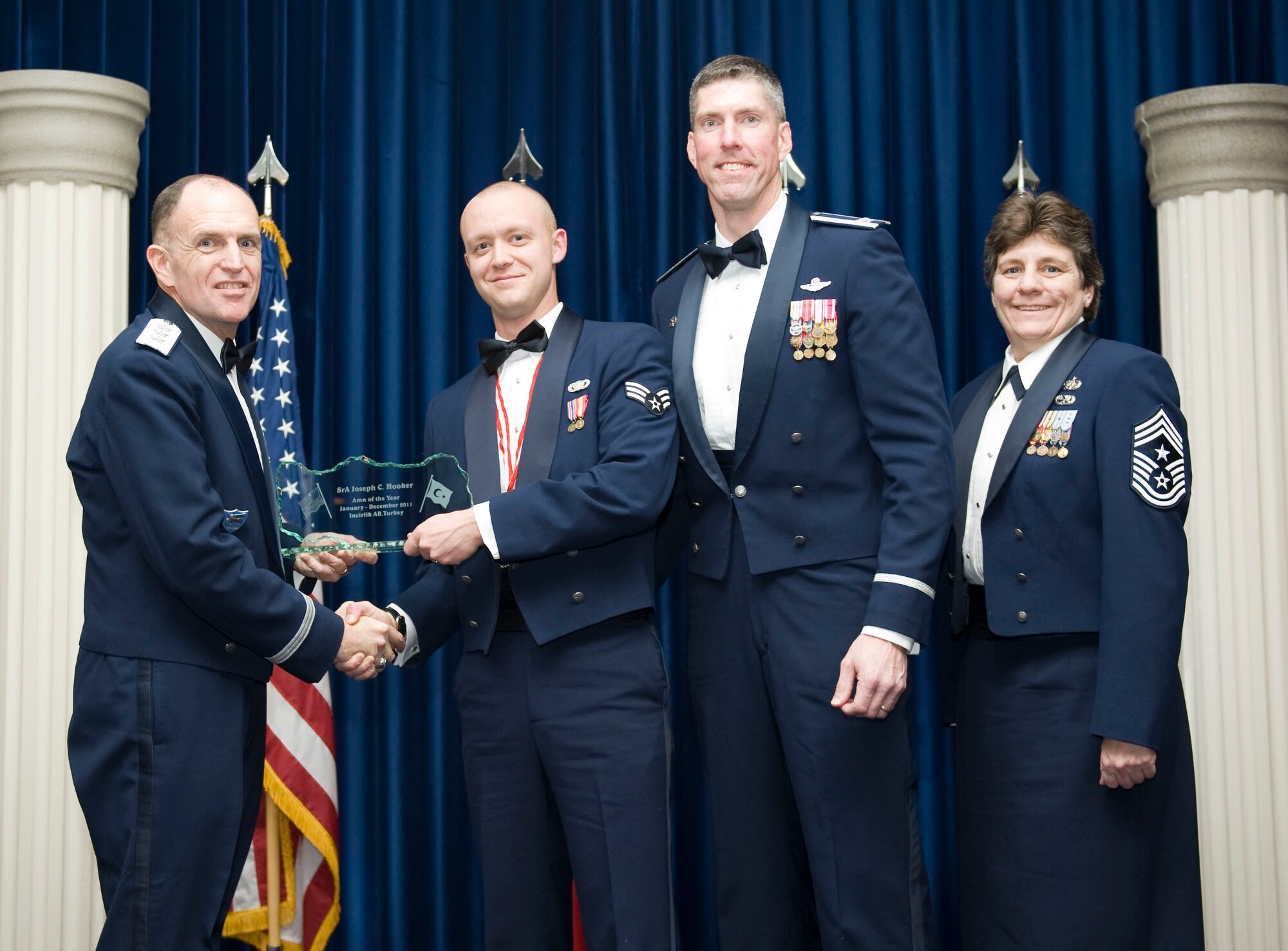 Senior Airman Joseph Hooker, 39th Security Forces Squadron, receives the 2011 39th Air Base Wing Airman of the Year award from Lt. Gen. Ralph J. Jodice II, commander of Allied Air Component Command Headquarters in Izmir, Turkey, Feb. 21, 2012, at Incirlik Air Base, Turkey. The annual awards banquet is held to recognize members of the 39th ABW who excelled in the 2011 calendar year. (U.S. Air Force photo by Senior Airman Clayton Lenhardt/Released)
