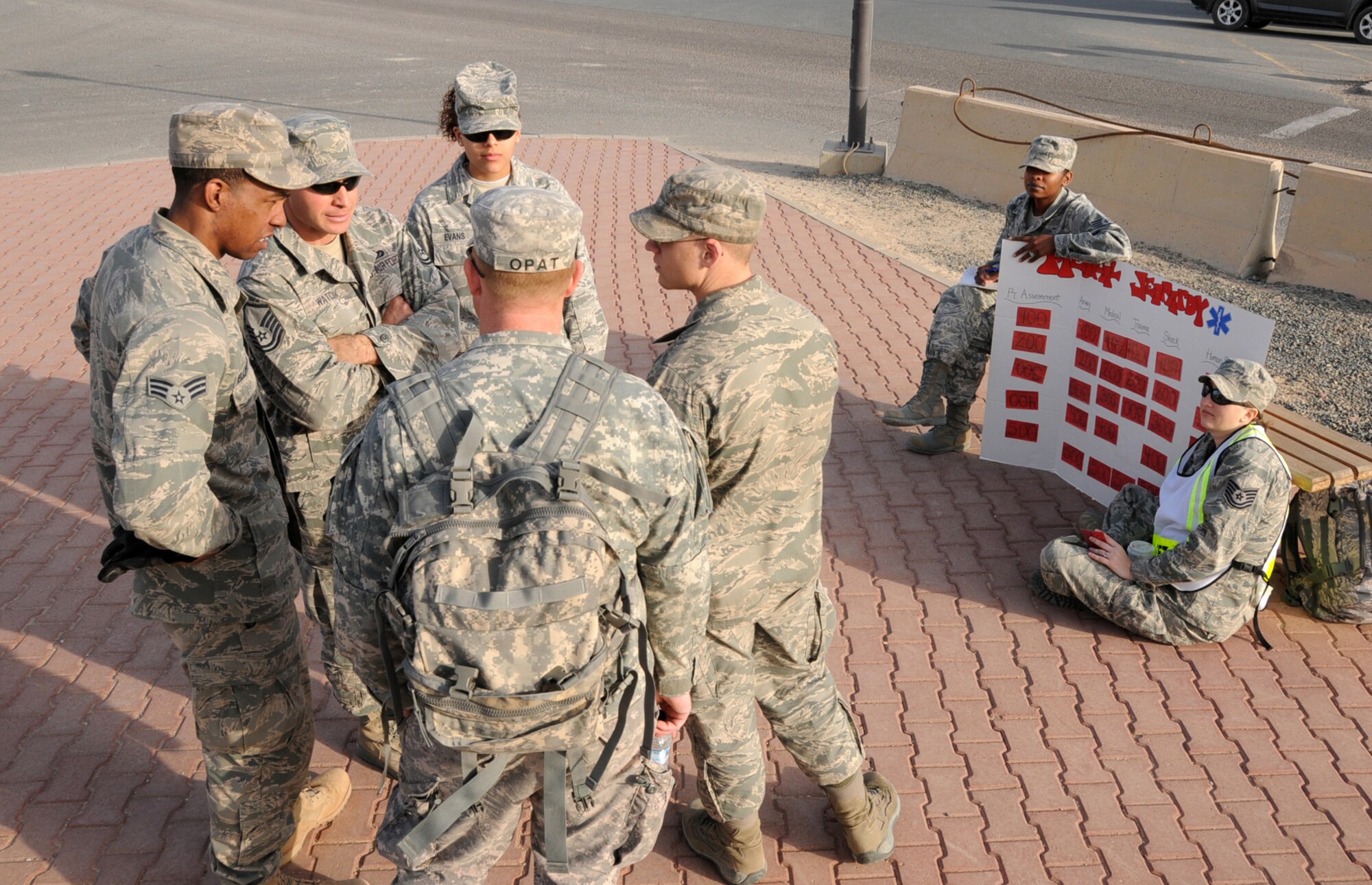 U.S. Airmen and a U.S. Soldier participate in medical jeopardy as part of an EMT Rodeo hosted by the 386th Expeditionary Medical Group in an undisclosed location, Southwest Asia, Feb. 18, 2012.  These emergency medical technicians participated in the competition to test their skills and knowledge in responding to different emergency situations alongside military and civilian EMT personnel from the Air Force, Army, and Navy. (U.S. Air Force photo by Staff Sgt. James Lieth/Released)