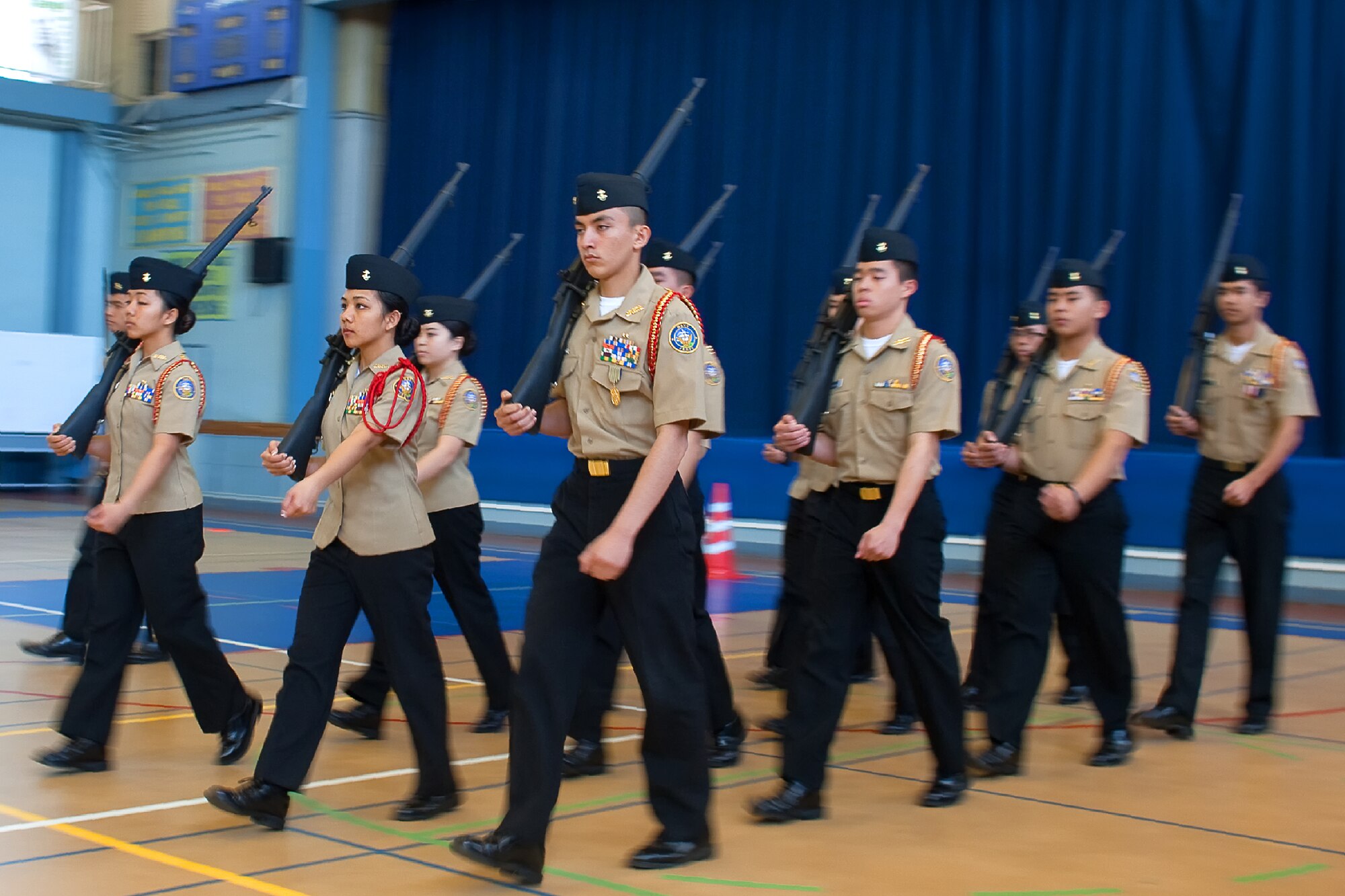 YOKOTA AIR BASE, Japan -- Nile C. Kinnick High School?s armed drill team from the Commander Fleet Activities, Yokosuka, Japan, perform armed drill movements during the Junior Reserve Officers' Training Corps regional drill meet at Yokota High School, Feb. 18, 2012. Seven, U.S. Department of Defense Dependents High Schools participated in the meet. The N.C. Kinnick High School received 1st place. (U.S. Air Force photo/Osakabe Yasuo) 