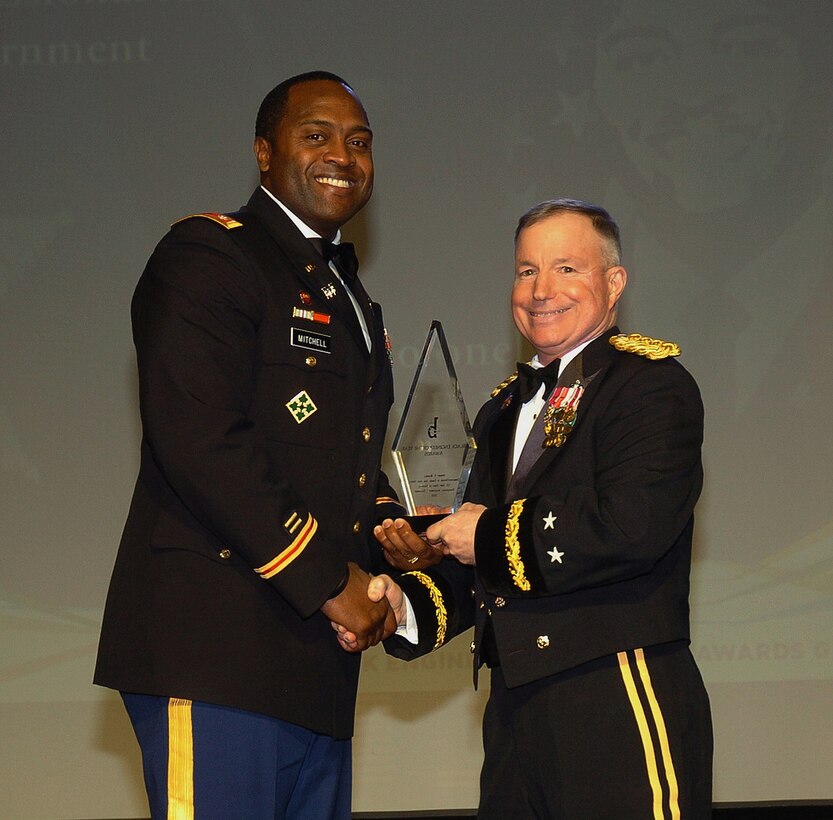 PHILADELPHIA, Pa. — Col. Anthony P. Mitchell (left), Commander in Charge, Iraq Area Office, is presented with the Professional Achievement in Government Award by Maj. Gen. Merdith "Bo" Temple, U.S. Army Corps of Engineers acting commander, at the BEYA Awards Gala here, Feb. 18, 2012. 