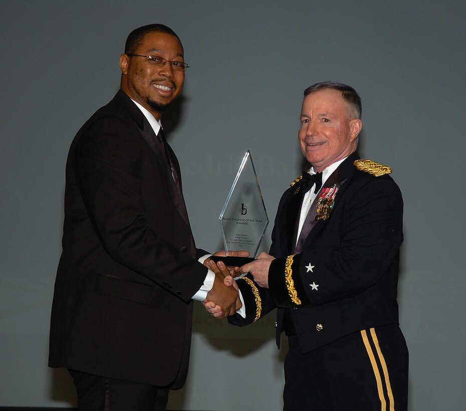 PHILADELPHIA, Pa. — Cedric Bazemore (left), U.S. Army Corps of Engineers project manager, is presented with the Most Promising Engineer in Government Award by Maj. Gen. Merdith "Bo"  Temple, U.S. Army Corps of Engineers Acting Commander, at the BEYA Awards Gala here, Feb. 18, 2012.