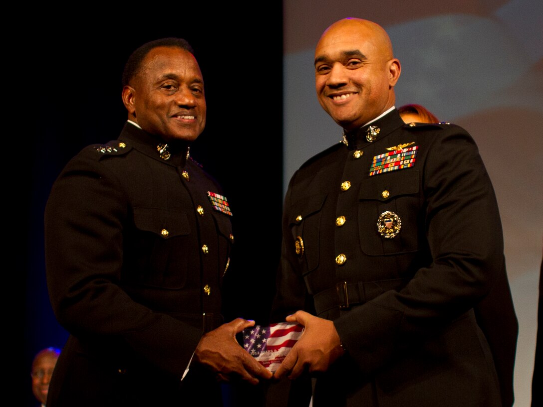 Lt. Gen. Willie J. Williams presents Lt. Col. Brian Cavanaugh, Director of Marine Corps Safety, with the Stars and Stripes award at the 7th Annual Stars and Stripes Dinner, part of the 26th Annual National Black Engineer of the Year Awards (BEYA) Science Technology Engineer Math (STEM) Global Competitiveness Conference, Feb. 17, Philadelphia. The award recognizes pioneers who have achieved career gains in government, merited lifetime achievement recognition and have energized their companies and their communities alike. Gen. James F. Amos, Commandant of the Marine Corps, was the keynote speaker, and stressed the importance of reaching out to the best and brightest technology minds in the country. This is the first year the Marine Corps hosted the Stars and Stripes Dinner.