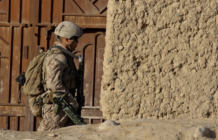 Lance Cpl. Edgar Lima, a sweeper with 2nd squad, 1st platoon, Lima Company, scans for improvised explosive devices, while patrolling in Wishtan, Feb. 22. Lima, currently deployed with 3rd Battalion, 7th Marine Regiment helped identify a 40-pound improvised explosive device with 39 sticks of dynamite. Lima said he looks forward eating his mom’s cooking and drinking coffee on his porch when he returns to the U.S.