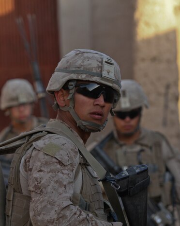 Cpl. Frank Villa, a team leader with 2nd Squad, 1st Platoon, Lima Company, patrols the town of Wishtan, Feb. 22. The squad, currently deployed with 3rd Battalion, 7th Marine Regiment, patrolled with an Afghan National Civil Order Policeman with 1st Tolai, 4th Kandak, 3rd Brigade.