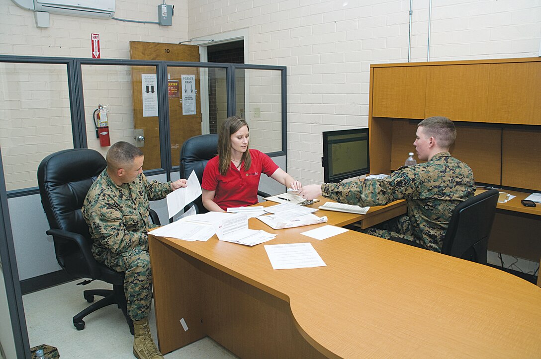 Gunnery Sgt. Jon Swan, amphibious assault vehicle repairman with Supply Management Center, Marine Corps Logistics Command, and his wife, Shelley, file their taxes at Marine Corps Logistics Base Albany’s Tax Center, Feb. 10.