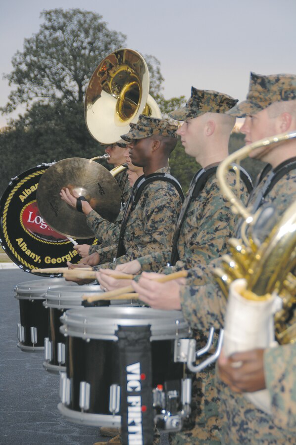 The Albany Marine Band performs its final morning colors ceremony in front of Building 3500, Friday. Marines and civilian-Marines, from various commands throughout the base, were entertained with a selection of melodies. The band is being deactivated Feb. 17.