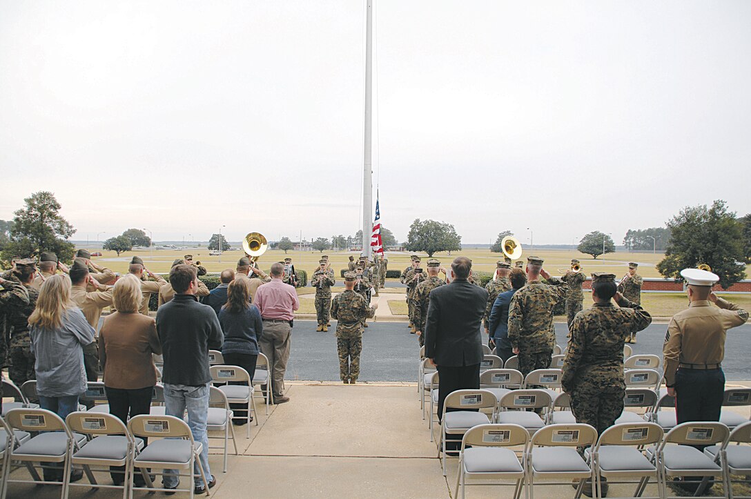 The Albany Marine Band performs its final morning colors ceremony in front of Building 3500, Friday. Marines and civilian-Marines, from various commands throughout the base, were entertained with a selection of melodies. The band is being deactivated Feb. 17.