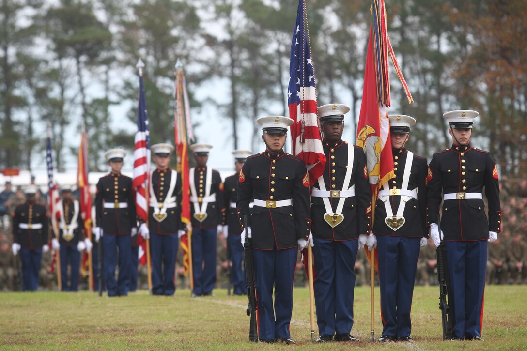 Color guards of various tennant commands stationed aboard Marine Corps Base Camp Lejeune stand at attention during the 2011 Joint Daytime Ceremony held aboard the base, Nov., 9. Showcasing a cake-cutting ceremony amidst columns of Marines in a multitude of uniforms spanning the centirues since 1775, service members and civilians alike were treated to a succinct telling of the Marine Corps' history.