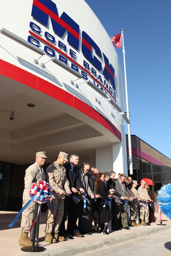 Base officials, service members and Marine Corps Community Services employees combine their ribbon cutting powers at the grand opening of the revamped Marine Corps Exchange aboard Marine Corps Base Camp Lejeune, Nov. 2