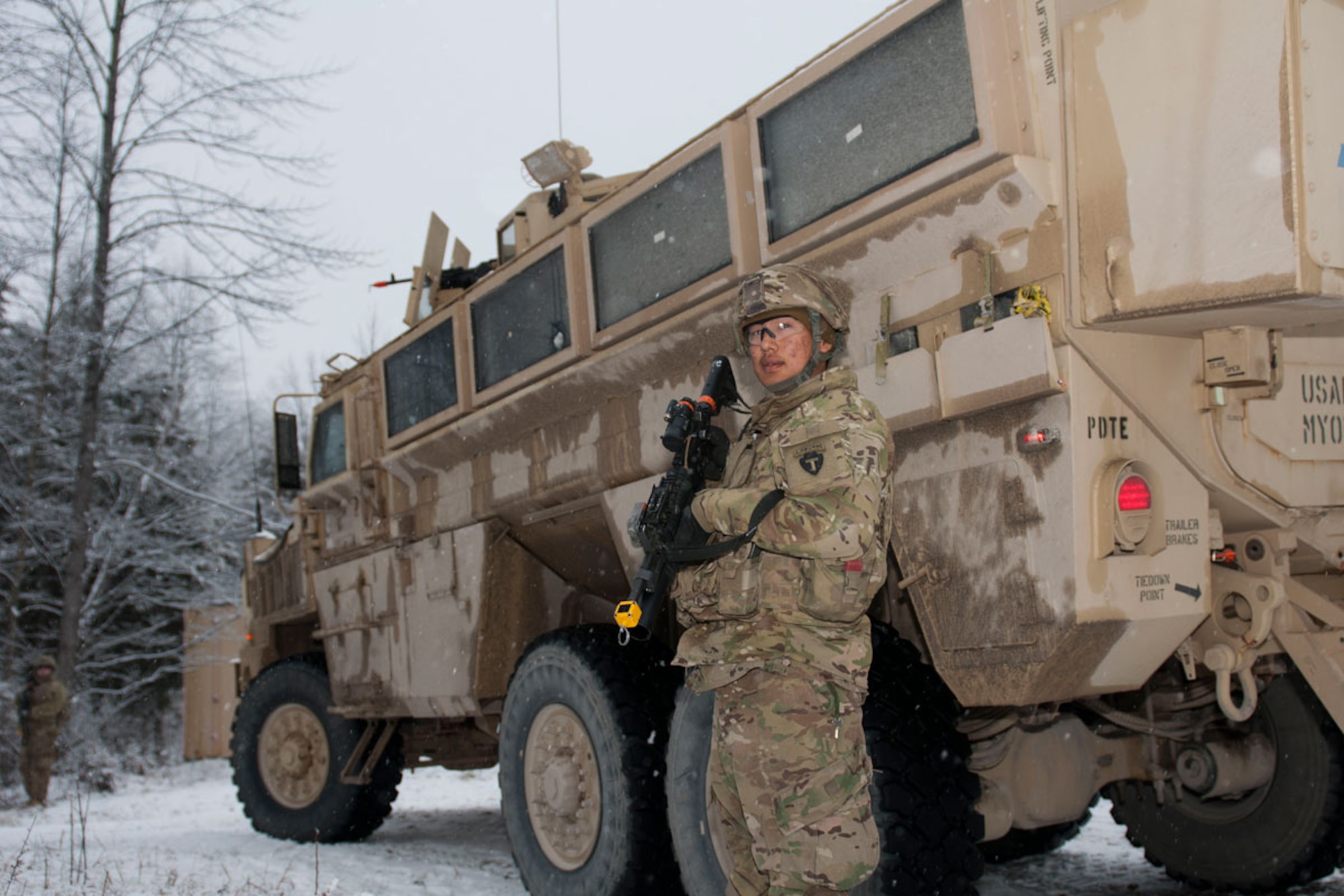 Kwethluk resident Pfc. Randell Andrew, B Company, 1st Battalion (Airborne), 143rd
Infantry Regiment, pulls security by an RG-33 Armored Utility Variant mine-resistant ambush-protected vehicle during a training mission at Camp Atterbury, Ind., Feb. 14. (U.S. Army photo/Staff Sgt. Karima Turner)