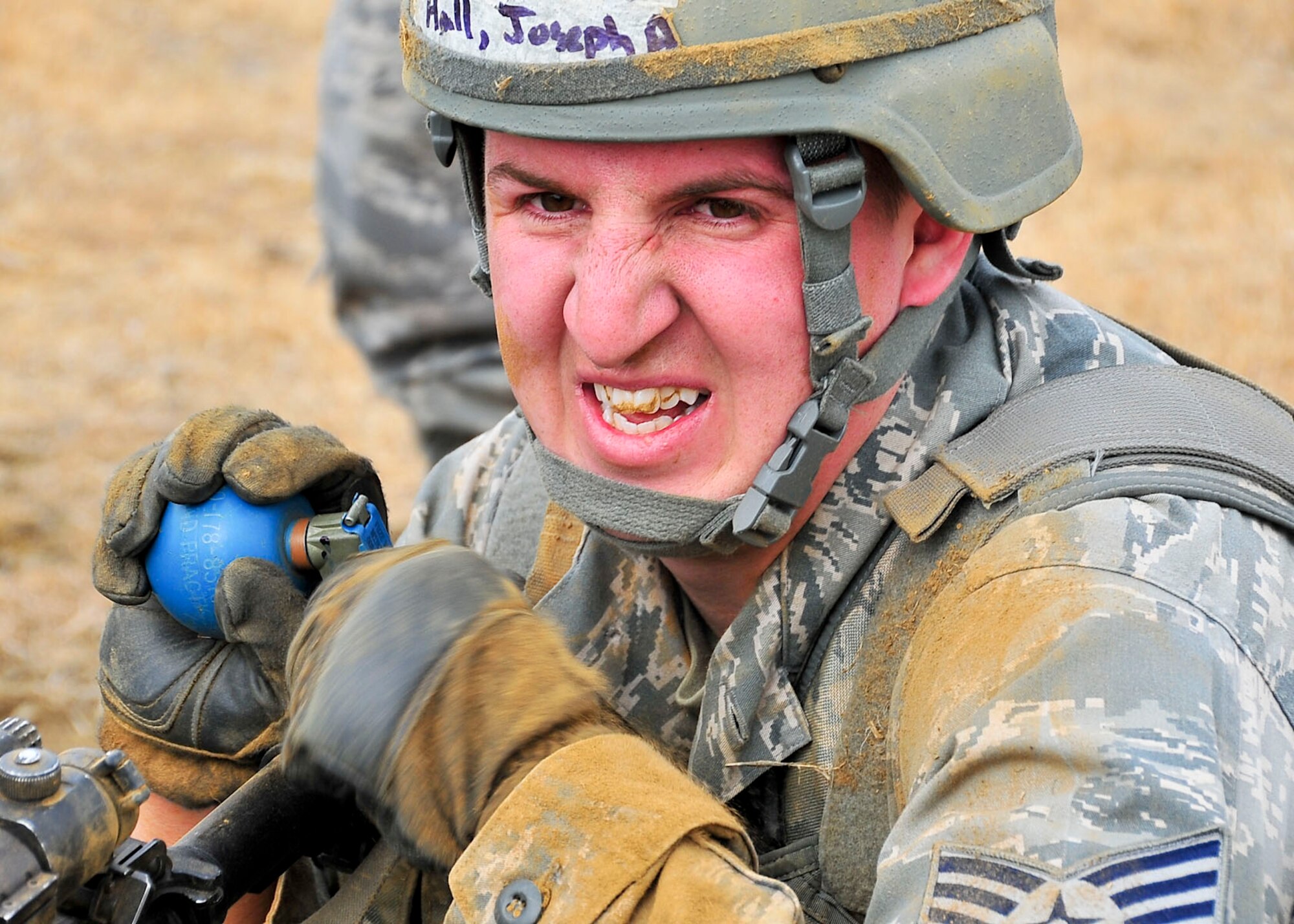 Staff Sgt. Joseph Hall, 51st Security Forces Squadron member, prepares to throw a training grenade during the confidence course portion of the Combat Readiness Course here, Feb. 23, 2012. The confidence course to tests participants both physically and mentally with the overall goal of ensuring they’re prepared to defend Osan Air Base at a moment’s notice. (U.S. Air Force photo/Senior Airman Adam Grant)