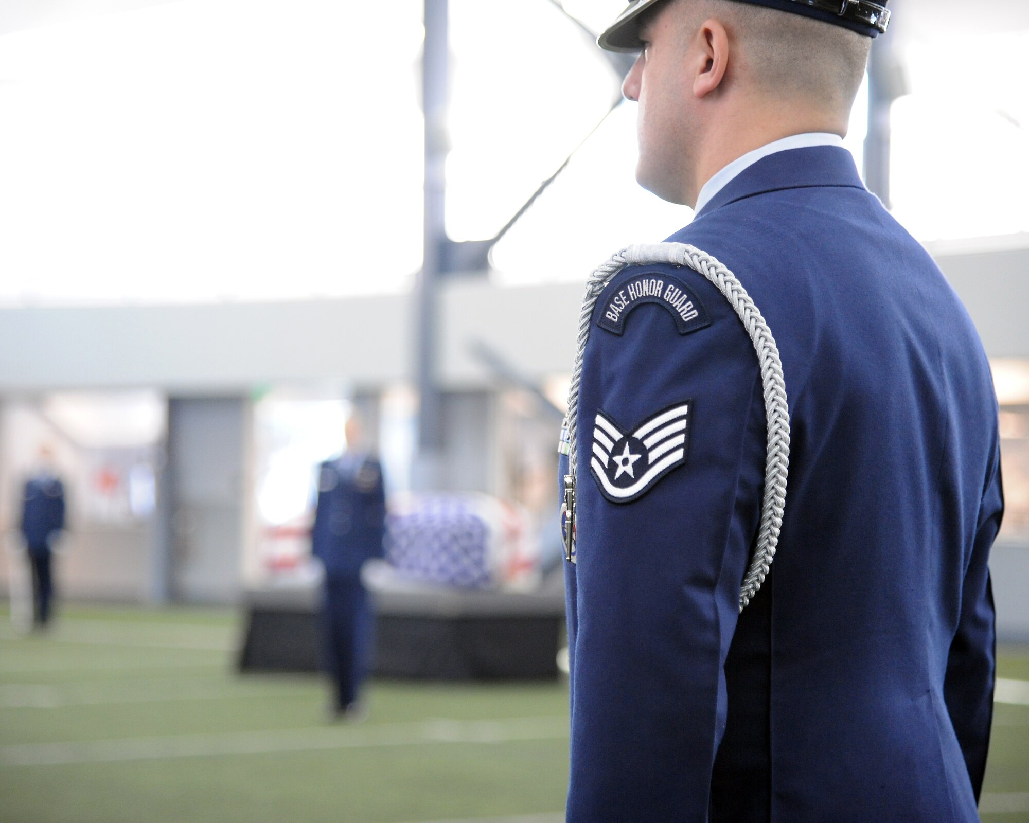 A member of the Eielson Air Force Base Honor Guard stands at attention during a demonstration of an honor guard ceremony Feb. 17, 2012, at Baker Field House, Eielson Air Force Base, Alaska. The demonstration, representative of a military funeral with full honors, rounded out a week’s worth of honor guard training and included a graduation ceremony for 28 new members. (U.S. Air Force photo/Senior Airman Willard E. Grande II)
