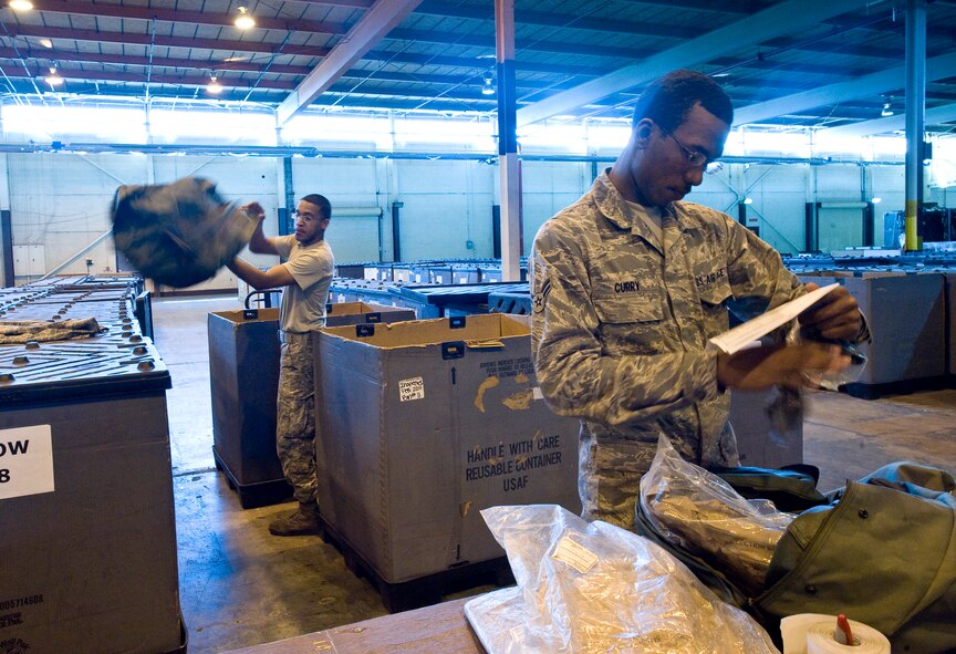 Airmen 1st Class Stephen Walker (left) and Cameron Curry, 2nd Logistics Readiness Squadron, inventory chemical warfare bags to ensure no components expire within the next year in the supply warehouse on Barksdale Air Force Base, La., Feb. 23. Supply Airmen ensure Barksdale Airmen have everything they need to perform the mission here and at deployed locations.  (U.S. Air Force photo/Senior Airman Chad Warren)(RELEASED)