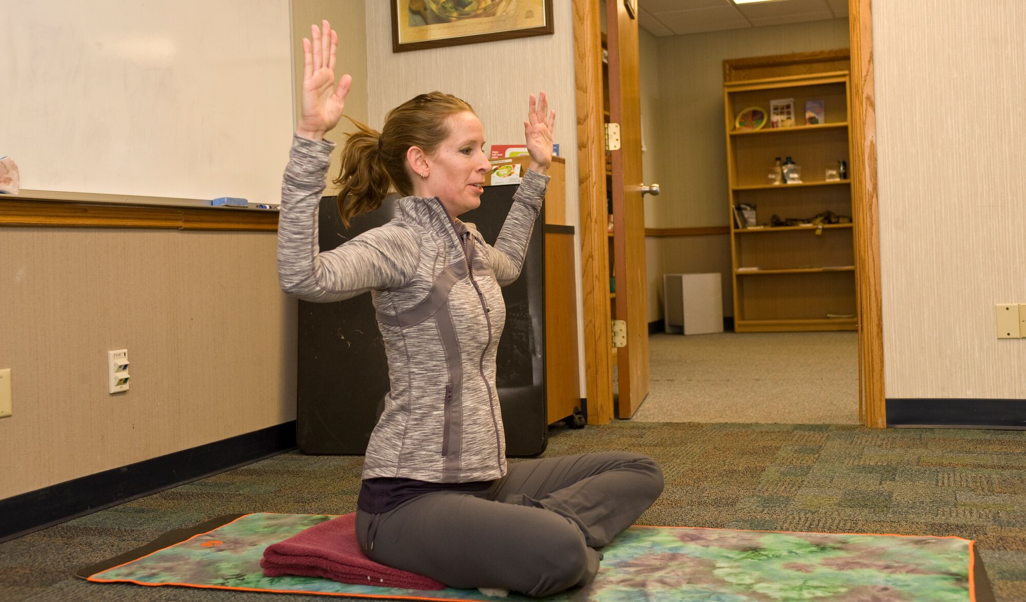 McKay Moore, yoga instructor, teaches the yoga pose "Cactus Arms" during the Fit Pregnancy yoga class at the Health and Wellness Center on Ellsworth Air Force Base, S.D., Feb. 16, 2012.  The yoga pose aligns the spine which will help keep the spine aligned during pregnancy.  (U.S. Air Force photo by Airman 1st Class Anania Tekurio/Released)