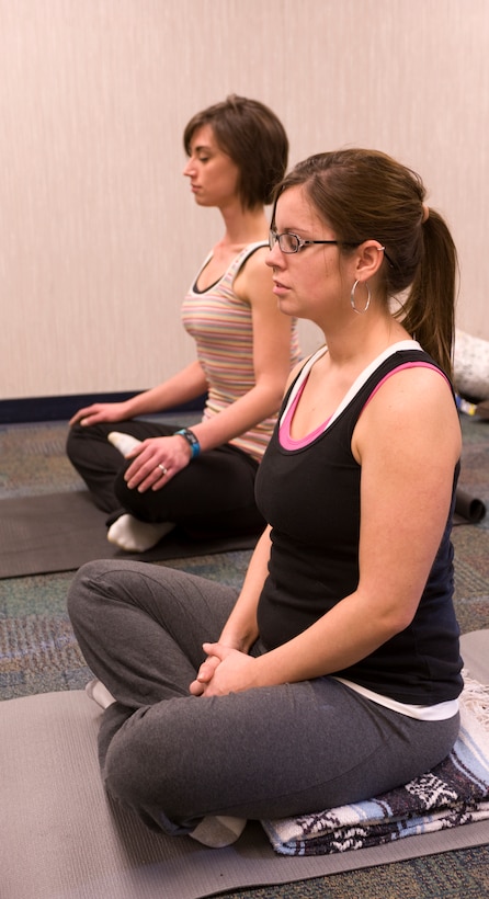 Lisa Merriss, right, wife of Airman 1st Class Eric Merriss, 28th Operations Support Squadron intel anaylsis, and Michelle Haleck, registered dietician, practice breathing exercises during the Fit Pregnancy yoga class at the Health and Wellness Center on Ellsworth Air Force Base, S.D., Feb. 16, 2012.  The Fit Pregnancy program offers yoga and includes information on proper nutrition for pregnant women.  (U.S. Air Force photo by Airman 1st Class Anania Tekurio/Released)