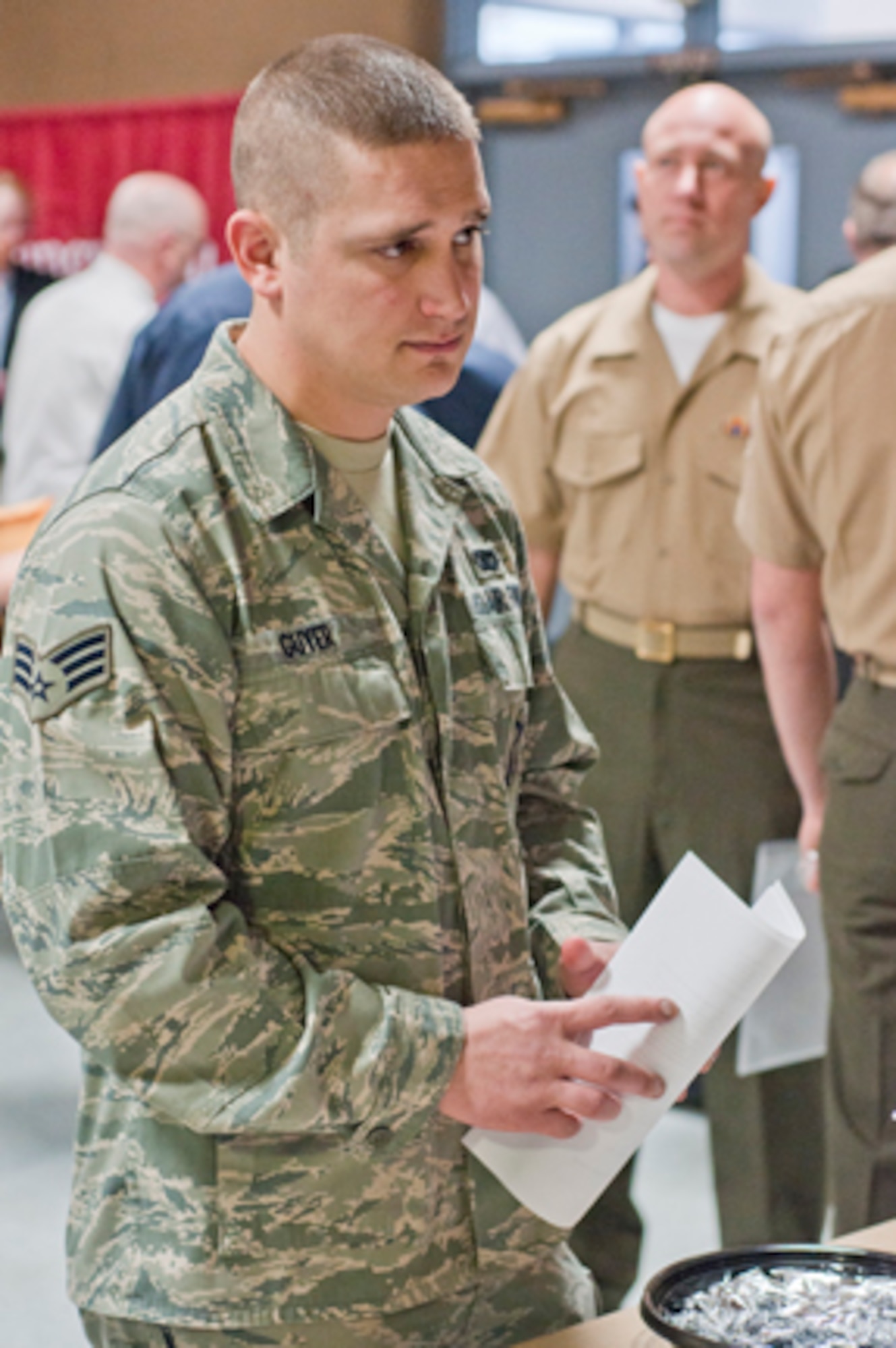 Senior Airman John Guyer Jr., a member of the 910th Security Forces Squadron, visits an employer’s table at a job fair hosted by the Marine Corps Reserve Landing Support Equipment Company here, Feb. 23. The event welcomed approximately 200 veterans and service members to meet representatives from eight local employers, as well as job counselors and colleges offering veterans programs. The eight represented employers had approximately 300 jobs to offer at the event.