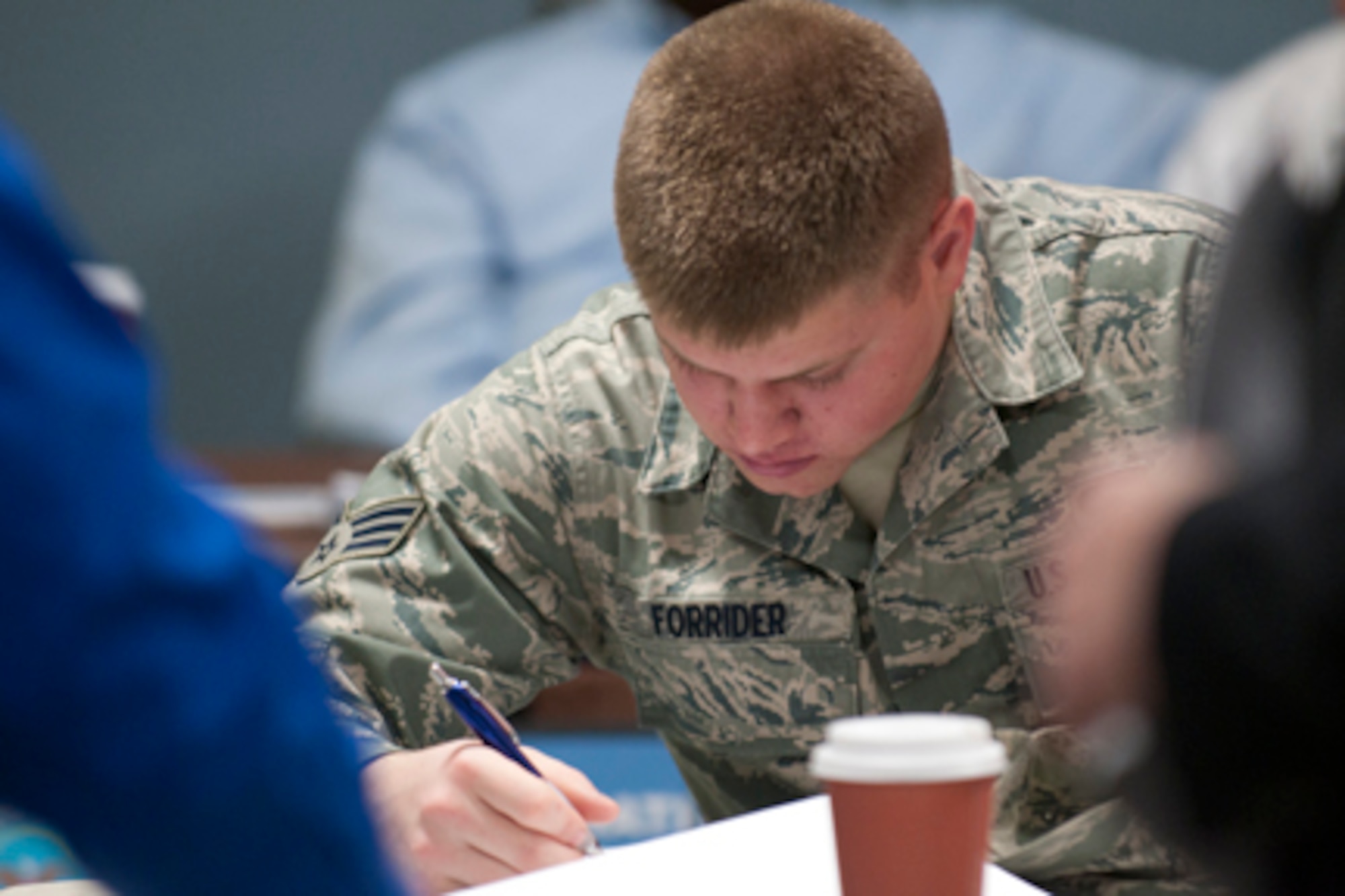 Senior Airman Zachary Forrider, an aerospace maintenance helper with the 910th Maintenance Squadron, visits an employer’s table at a job fair hosted by the Marine Corps Reserve Landing Support Equipment Company here, Feb. 23. The event welcomed approximately 200 veterans and service members to meet representatives from eight local employers, as well as job counselors and colleges offering veterans programs. The eight represented employers had approximately 300 jobs to offer at the event.