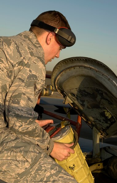 Airman 1st Class Zachary Reph, 11th Aircraft Maintenance Unit, connects the pilot chute canister to the bottom of a drogue chute hatch on Barksdale Air Force Base, La., Feb. 21. The pilot chute is the small parachute that is deployed first as the B-52H Stratofortress lands. The force of the first deployment is used to pull out the larger parachute which slows down the aircraft as it lands. (U.S. Air Force photo/Airman 1st Class Benjamin Gonsier)(RELEASED)