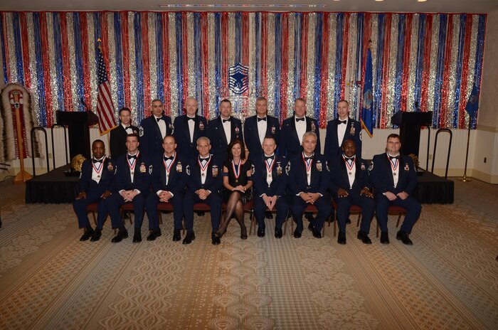 Kathy Knichel sits center stage among Joint Base Charleston's leadership and new chief master sergeants after being named as an honorary chief master sergeant at the Chief's Recognition Ceremony at JB Charleston's - Air Base Club Feb. 4. Knichel is the 628th Air Base Wing protocol officer. (U.S. Air Force photos/Tech. Sgt. Chrissy Best)