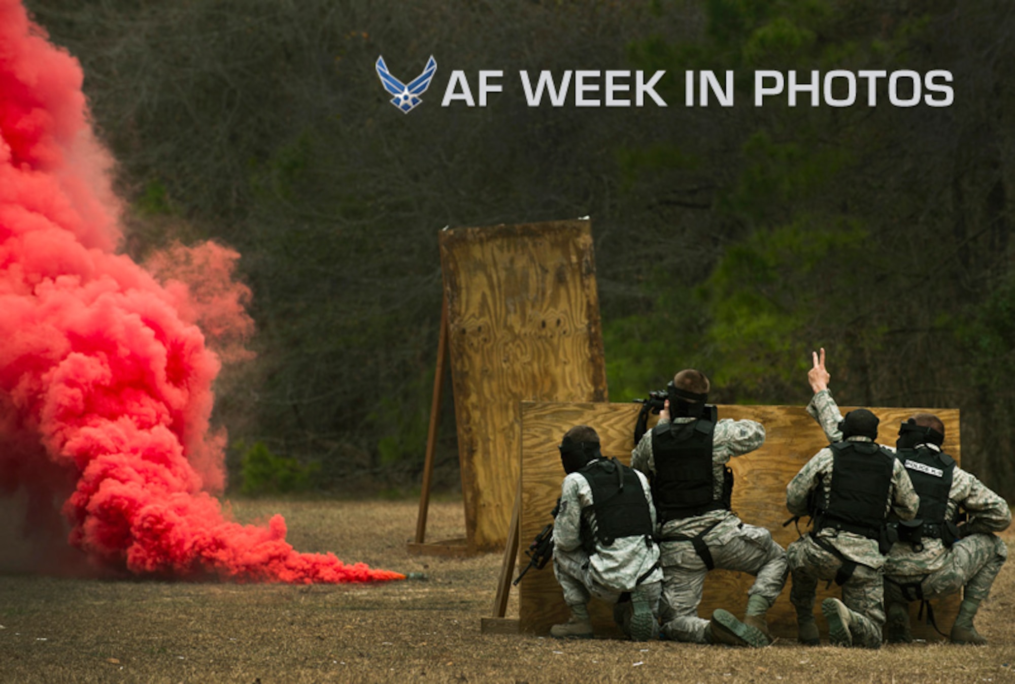 Airmen take cover behind a wall during a “Shoot, Move, Communicate” training course Feb. 16, 2012, at Joint Base Charleston, S.C. The training teaches Airmen to react to a hostile shooter by using cover and effective communication to maneuver and engage the target. (U.S. Air Force photo/Airman 1st Class George Goslin)
