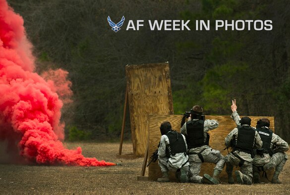 Airmen take cover behind a wall during a “Shoot, Move, Communicate” training course Feb. 16, 2012, at Joint Base Charleston, S.C. The training teaches Airmen to react to a hostile shooter by using cover and effective communication to maneuver and engage the target. (U.S. Air Force photo/Airman 1st Class George Goslin)