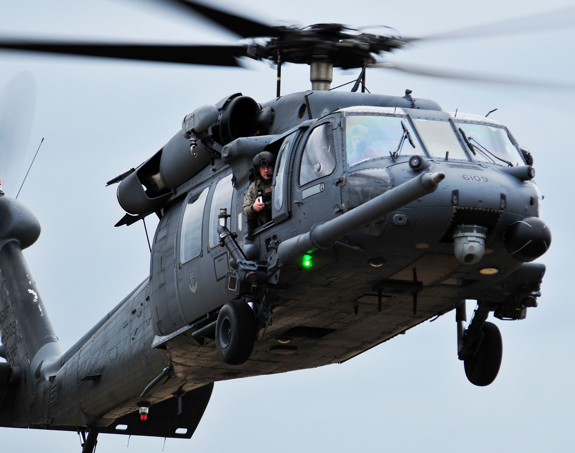 STANFORD TRAINING AREA, England – An HH-60G Pave Hawk prepares to land after pararescuemen from the 56th Rescue Squadron parachuted out Feb. 15, 2011. The pararescuemen were performing static line jumps, which involves a mechanism that opens a parachute automatically with no action required by the passenger. This is the first time that the 56th RQS has performed static line jumps since being stationed at Royal Air Force Lakenheath. (U.S. Air Force photo by Senior Airman Tiffany M. Deuel)