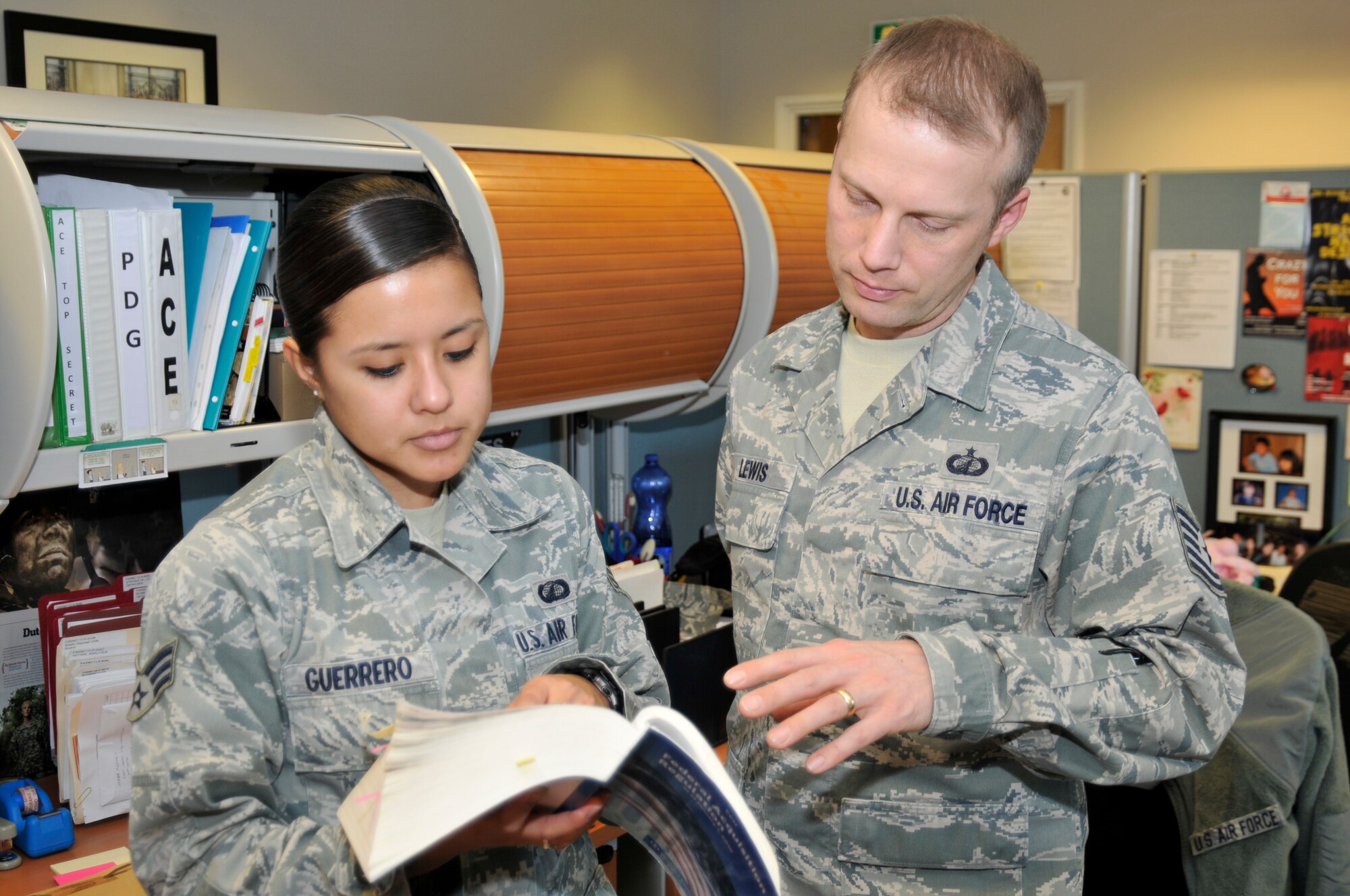 ROYAL AIR FORCE LAKENHEATH, England -- Senior Airman Veronica Guerrero, 48th Contracting Squadron Contracting specialist, helps a customer, Feb. 1, 2012. Guerreo was nominated for a Liberty Spotlight because she displays the core value of 'Service Before Self'. (U.S. Air Force photo by Staff Sgt. David Dobrydney) 