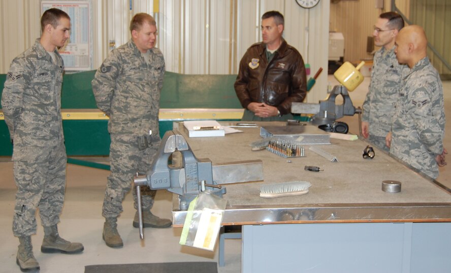 Col. Lenny Richoux (center), 6th Air Mobility Wing commander, talks with Airmen in the 916th Maintenance Group during a visit here on Feb. 13, 2012. 6th Mobility Wing is the administrative wing for the 911th Air Refueling Squadron. (USAF photo by A1C Peter Harpster, 911th ARS)