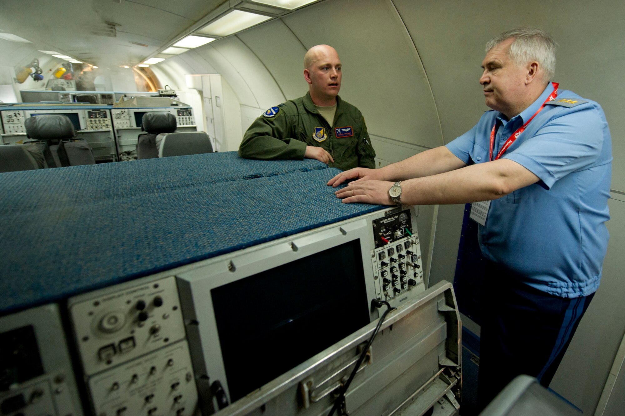 U.S. Air Force Capt. Joshua Craymer, an E-3 Sentry aircraft commander pilot, gives a tour of the Sentry to Commander-in-Chief of the Russian Air Force Col. Gen. Alexander Zelin at the 2012 Singapore Airshow on Feb. 15, 2012, in Changi, Singapore. Since the end of the Cold War, Zelin has also had the opportunity to visit the U.S. and fly in an F-16 Fighting Falcon and F-15E Strike Eagle. (U.S. Air Force photo/Tech. Sgt. Michael R. Holzworth)