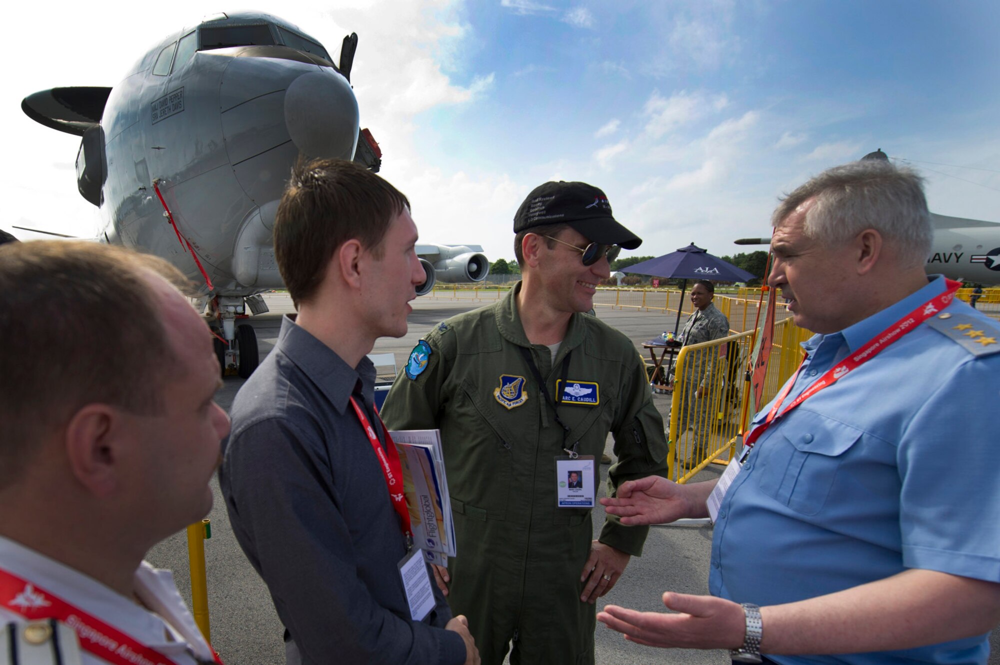 U.S. Air Force Col. Marc Caudill, the U.S Pacific Command mission commander for the U.S. forces supporting the 2012 Singapore Airshow, speaks to Commander-in-Chief of the Russian Air Force Col. Gen. Alexander Zelin before touring the E-3 Sentry on Feb. 15, 2012, in Changi, Singapore. While being the third largest trade show in the world, the biennial Singapore Airshow also provides the opportunity for airmen from many different countries to interact and improve foreign relations. (U.S. Air Force photo/Tech. Sgt. Michael R. Holzworth)