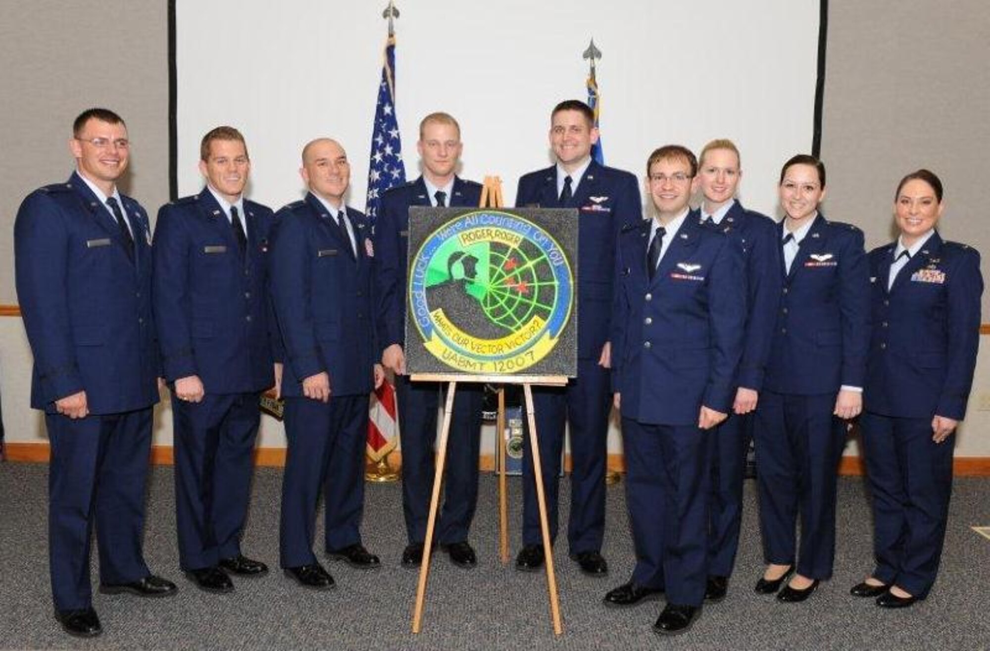 The Air Battle Manager graduating class of Feb. 22 decorated a ceiling tile as a momentum to leave behind at the school house. (U.S. Air Force photo by Lisa Norman)