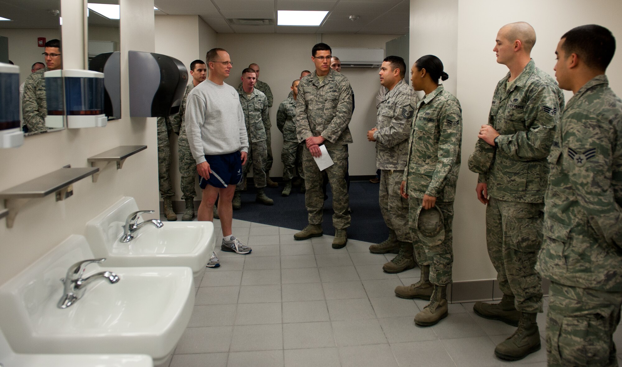 Col. Mark Weatherington, 28th Bomb Wing commander, tours a new and improved bathroom built by the 28th Civil Engineer Squadron’s Prime Base Engineer Emergency Force in the Pride Hangar at Ellsworth Air Force Base, S.D., Feb. 17, 2012.  The upgrade provided Airmen with critical construction training for combat missions while also improving the quality of life for Airmen and families who frequently use the facility. (U.S. Air Force photo by Airman 1st Class Kate Thornton/Released)