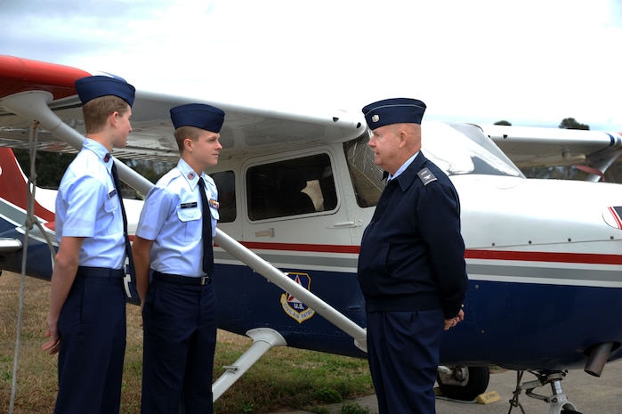 Civil Air Patrol Colonel Bob Townsend speaks with Cadet Chief Master Sgt. Alexander Durr and Cadet Chief Master Sgt. Tyler Hoover at the Coastal Charleston Composite Squadron on Joint Base Charleston - Air Base Feb. 6. The Civil Air Patrol has one of the largest fleets of single-engine aircraft in the world, with more than 550 aircraft nationwide.Townsend is the Deputy Commander for Cadets and has been a member of the CAP since 1964. Durr and Hoover have been members of the CAP since 2010. (U.S. Air Force photo/Airman 1st Class Ashlee Galloway)